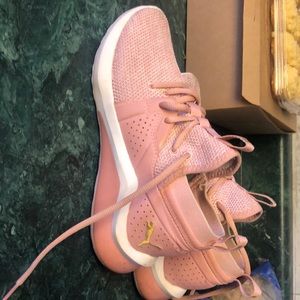 Pink and gold puma shoes